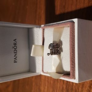 Genuine sterling silver Pandora Baby Stroller charm.